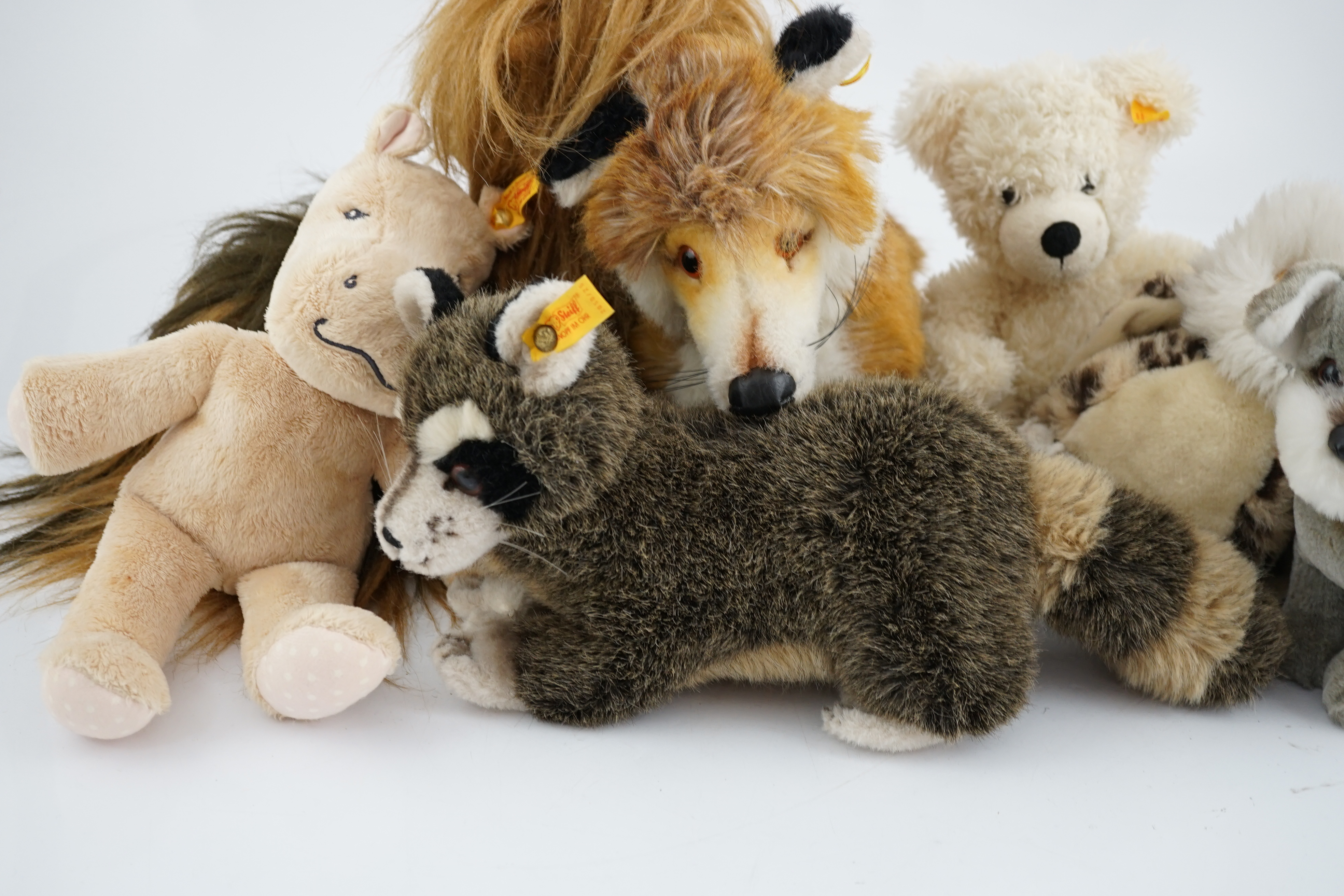 Nine assorted yellow tag Steiff animals, one Yorkshire Terrier, Steiff china plate, one yellow tag bear (12)